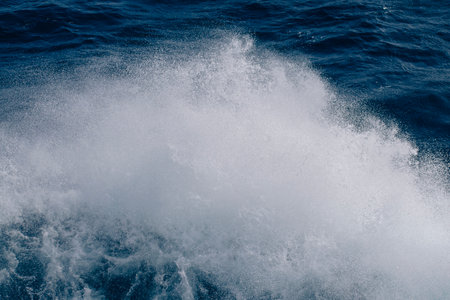 Boat wake waves in the Drake Passage, causing spray to come off the water.の写真素材