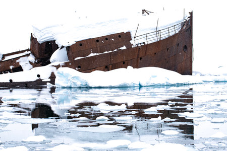 Ruins of an old ship in the ice floe, Antarctic Peninsulaの写真素材