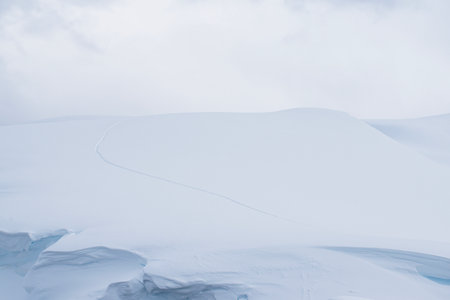 Beautiful winter landscape with white snow and blue sky in the mountainsの写真素材