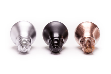Painted light bulbs on a white background for concept as energy and recyclingの写真素材