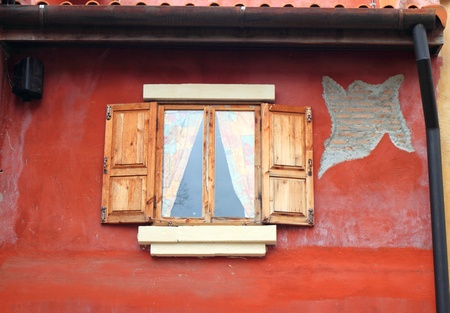 Window on wall red.の写真素材