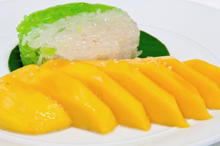 sweet sticky rice with mango topping with coconut milkの写真素材