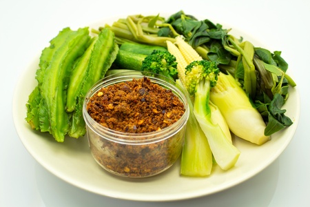 Blanched vegetables with a spicy sauceの写真素材
