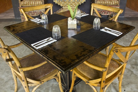 Wooden tables and chairs for dinnerのeditorial素材