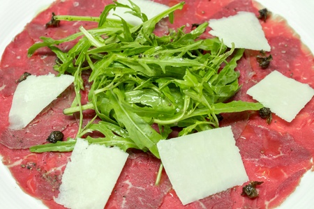Seared beef carpaccio with shaved parmesan and rocketの写真素材