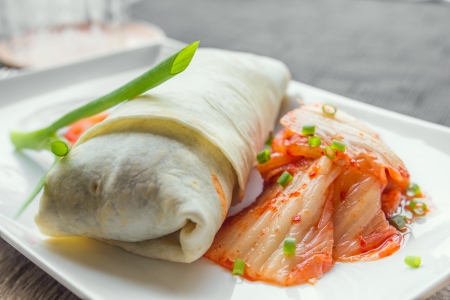 Beef burito with mizuna, bean sprout and kimchiの写真素材