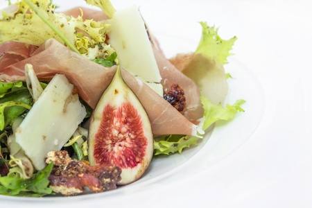 Salad of Chicory Walnuts, cheese  parma ham and figの写真素材