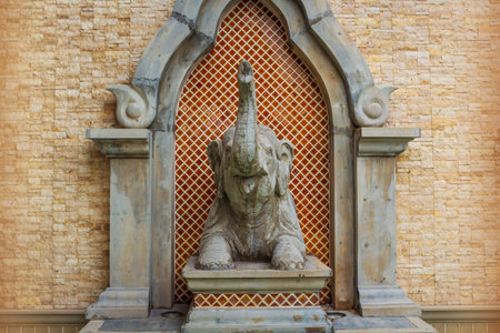 Brick wall and elephant statueの写真素材