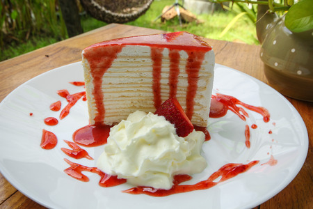crape cake with strawberry sauceの写真素材