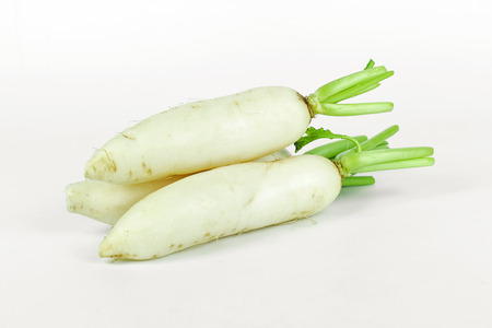 fresh slices white radish on wooden background, healthy vegatableの写真素材