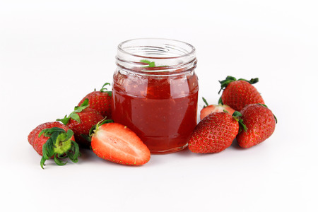fresh strawberry jam in glass bottle with mint leafの写真素材