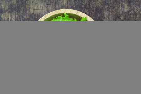 Salad leaf. Lettuce isolated on wooden backgroundの写真素材