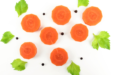 Fresh carrot with celery leaf on white backgroundの写真素材