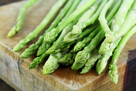 Green asparagus on a wooden backgroundの写真素材