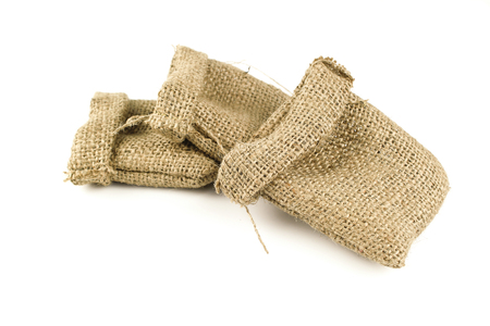 Hessian sack tied with string from low perspective isolated against white backgroundの写真素材