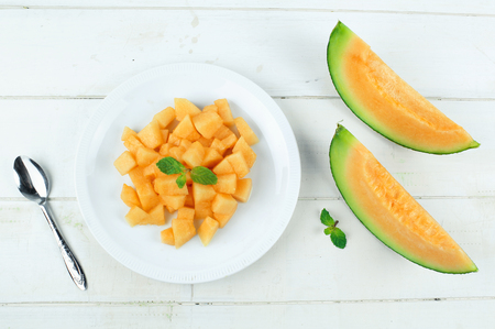 Fresh yellow melon or cantaloupe on white backgroundの写真素材