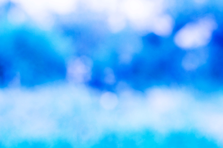 Image of a bright blue colorful bokeh backgroundの写真素材