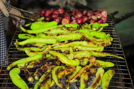 grilled fresh green chili pepper with shallotの写真素材