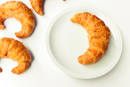 freshly baked croissants on white background, top viewの写真素材