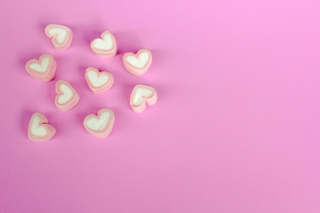 marshmallow heart shape with love concept on pink backgroundの写真素材