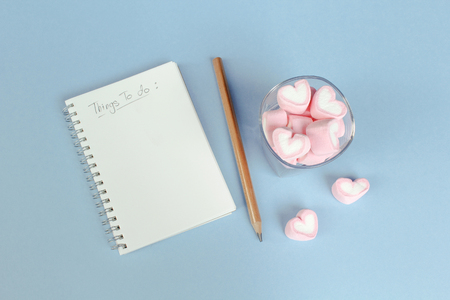 marshmallow heart shape with love concept on blue backgroundの写真素材