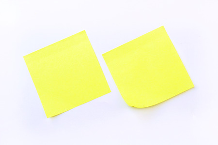 yellow sticky note isolate on white backgroundの写真素材