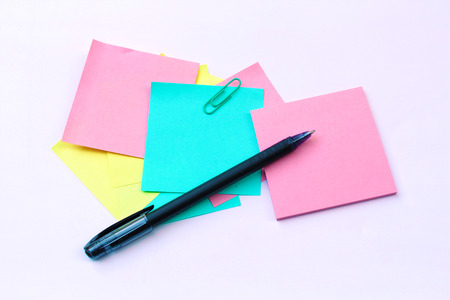 yellow, pink, blue sticky note isolate on white backgroundの写真素材