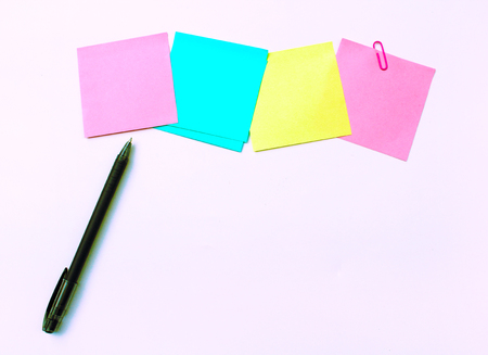 yellow, pink, blue sticky note isolate on white backgroundの写真素材