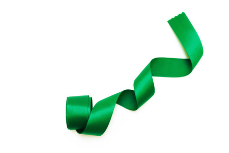 Green satin ribbon isolated on white backgroundの写真素材