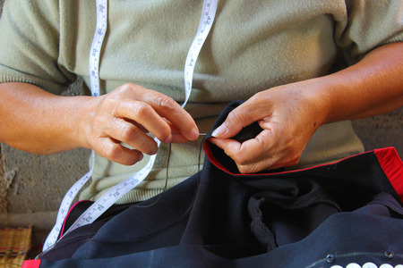 Women are sewing, tribal dress, Phuthai dressの写真素材