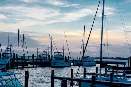 Boats docked at the Panama City Marina in Panama City, Florida during sunset on July 11, 2015.のeditorial素材