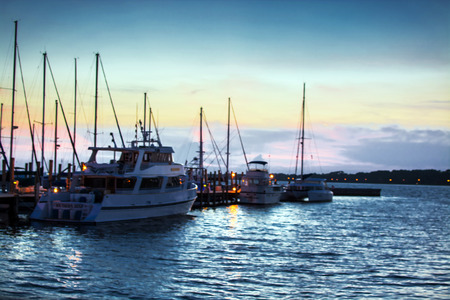 Boats at dock at sunset at Panama City Marina, Panama City, Florida on 7/11/2015.のeditorial素材