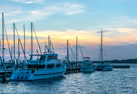 Boats at the Panama City Marina in Panama City, Florida docked at sunset on July 11, 2015のeditorial素材