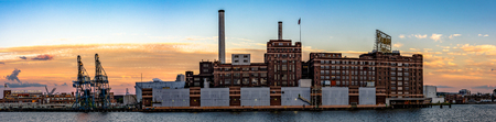 Baltimore, Maryland, USA - July 8, 2017: A panoramic view of the Domino Sugar refinery, the last manufacturing plant on the Inner Harbor. In operation since 1922, the refinery is a state-of-the-art facility that has the second highest sugar production capのeditorial素材