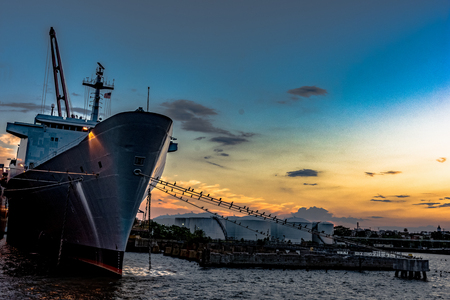 Baltimore, Maryland, USA - July 8, 2017: A ship docked in the Inner Harbor bay area as viewed at sunset.のeditorial素材