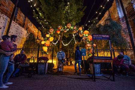 Prattville, Alabama, USA - Oct. 26, 2021: Visitors in downtown Prattville viewing the Parade of Pumpkins displays.のeditorial素材