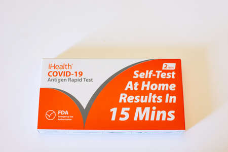 Single box of iHealth Covid-19 Antigen Rapid Tests on a white background.のeditorial素材
