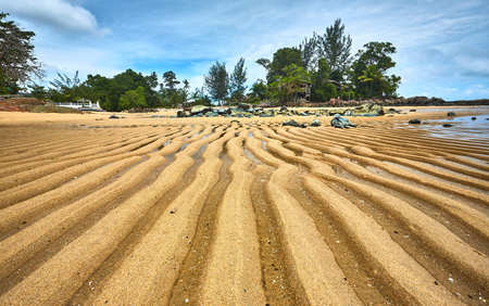 Pandan Beach, Lundu - 18 March 2017 - Beach sand patterns form after the rise and fall of sea...