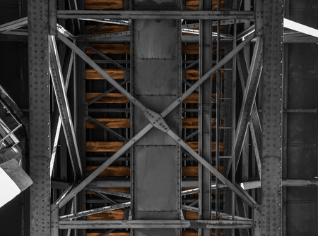 Old railway bridge in Porto, Portugal, black and white with colorized wooden planks