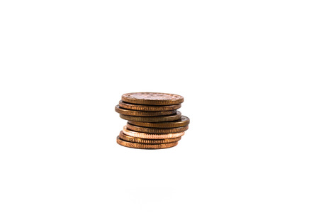 Stack of coins isolated on white backgroundの写真素材