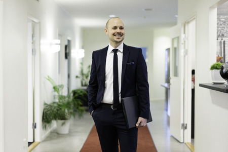 Swedish caucasian businessman. European Scandinavian. Smiling standing. Costume, suit, tie and...