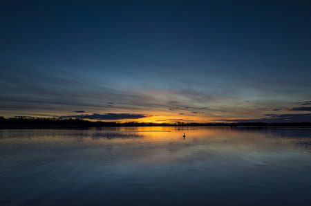Katrineholm Sweden Europe. Beautiful nature and landscape photo of colorful sunset at lake. Nice...