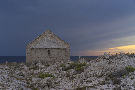 Chapel St Ivan at Punta Planka in Razanj Croatia. Beautiful old stone house in summer evening close Adriatic Sea in Dalmatia. Nice, calm and peaceful outdoors image.の写真素材