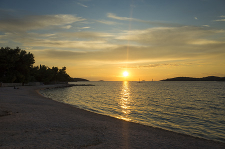 Beautiful sunset at Adriatic Sea in Croatia Europe. Nice warm colorful summer evening at the ocean. Calm, peaceful outdoors image. Wonderful nature and landscape photo. Happy, relaxing, joyful.のeditorial素材