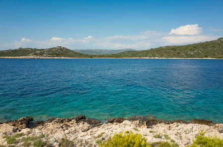 Beautiful nature and landscape photo of sunny summer day at Adriatic Sea in Dalmatia, Croatia, Europe. Nice outdoors at Mediterranean coast. Calm, peaceful and happy picture.の写真素材