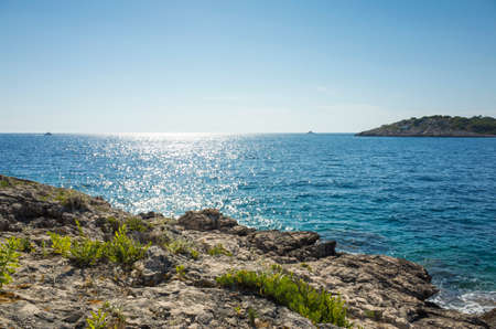 Beautiful nature and landscape photo of sunny summer day at Adriatic Sea in Dalmatia, Croatia, Europe. Nice outdoors at Mediterranean coast. Calm, peaceful and happy picture.の写真素材