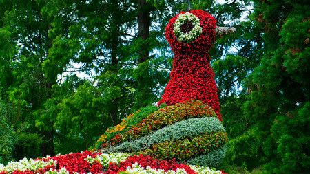 A colorful floral figure of a bird's fire on the island of Mainauの写真素材