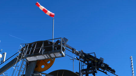 Wind sock indicates wind direction during a clear day in the afternoon
