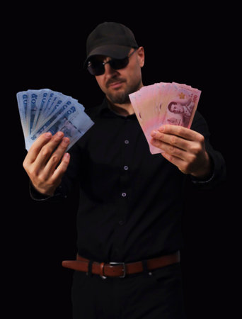 Stacks of currency displayed on bright red surface showcasing various banknotes