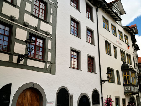 Historic buildings along a charming street in a quaint village showcasing traditional architecture...